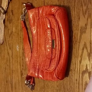 Unlabeled pink alligator skin purse